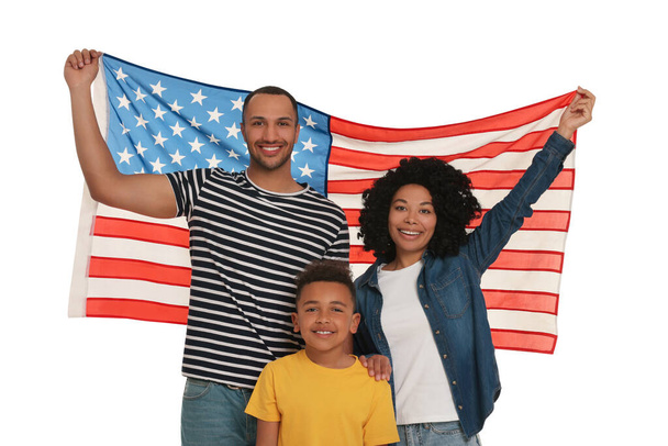 4th of July - Independence Day of USA. Happy family with American flag on white background - 写真・画像