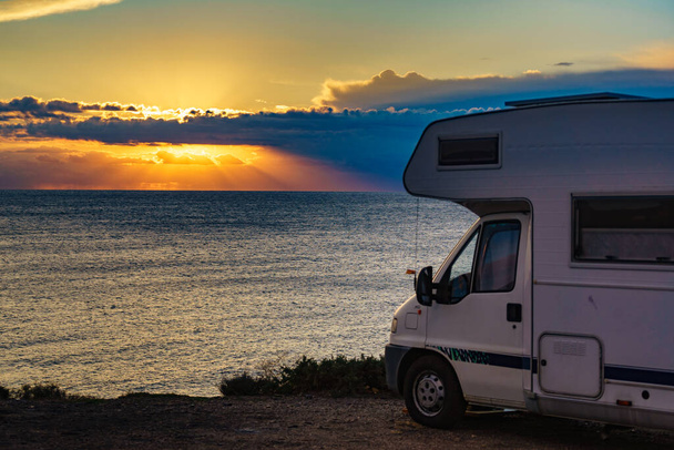 Camper rv camping on seacoast nature in the morning at sunrise. Holidays in Spain, travel with motor home. - Fotografie, Obrázek