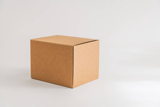 Closed cardboard box isolated on the white background - Photo, Image