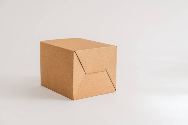Closed cardboard box isolated on the white background - Фото, изображение