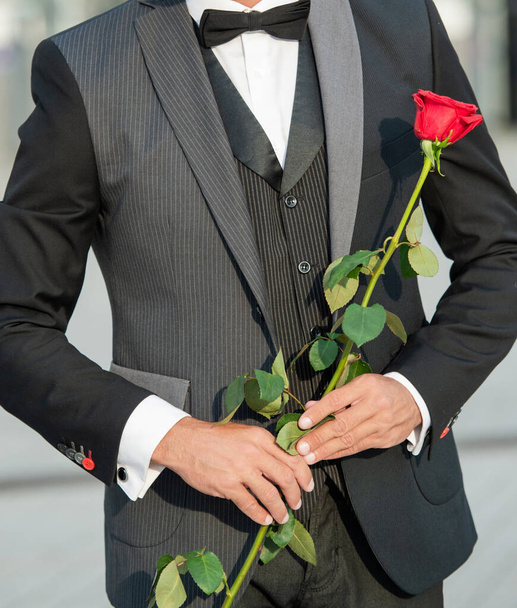 proposal concept. cropped view of black tuxedo man making a proposal. man before marriage proposal. - 写真・画像