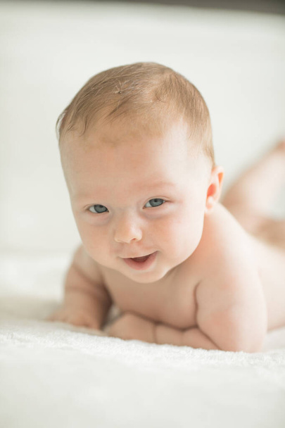 Cute little baby crawling. Family morning at home.  Beautiful smiling son. Beautiful happy child. - Photo, Image