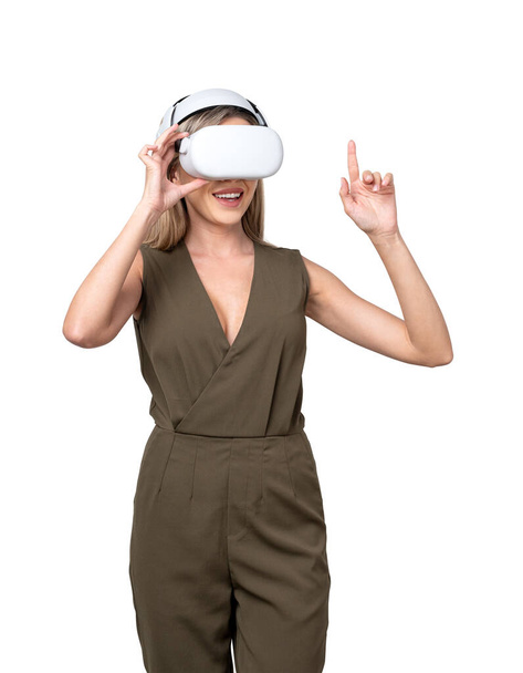Smiling businesswoman working in vr glasses headset, finger touching something, isolated over white background. Concept of metaverse and virtual reality - Photo, Image