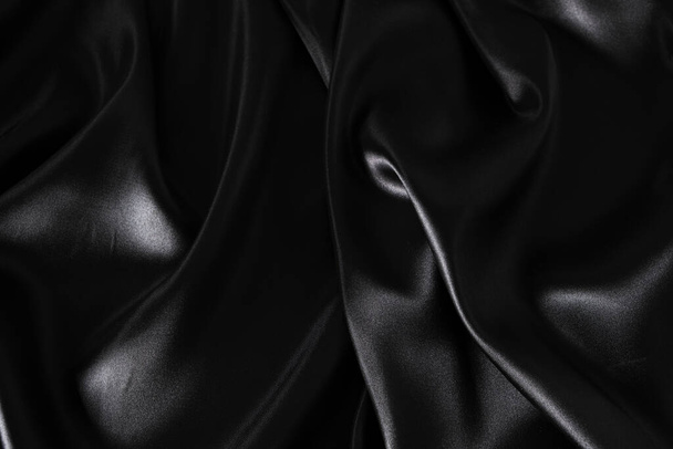 Silk fabric, abstract wavy black satin fabric background - Foto, imagen