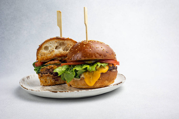 A delicious hamburger from a restaurant. Close up - Foto, Imagem