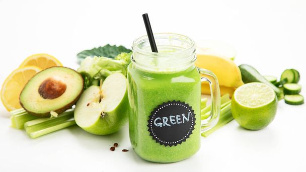 Healthy green smoothie  in a jar mug  on white background. - Photo, Image