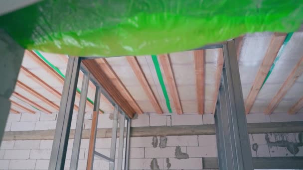 Building a room from frame walls indoors. Metal frame for plasterboard walls. High quality FullHD footage - Footage, Video