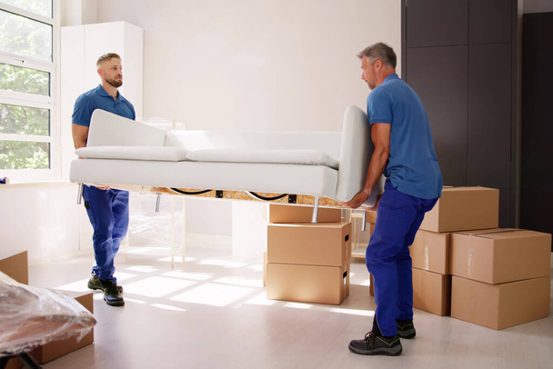 Professional Furniture Mover And Delivery. Moving Couch - Foto, afbeelding