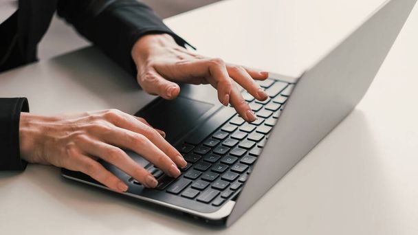 Online communication. Technology lifestyle. Virtual management. Female business woman hands texting tapping on laptop keyboard in light workspace. - Photo, image
