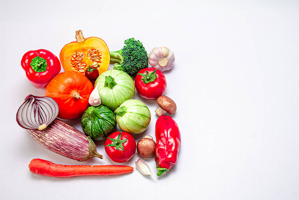 Fresh organic vegetables on a white background. Photo top view. The concept of a balanced diet. Copy space. Food photo. - Valokuva, kuva