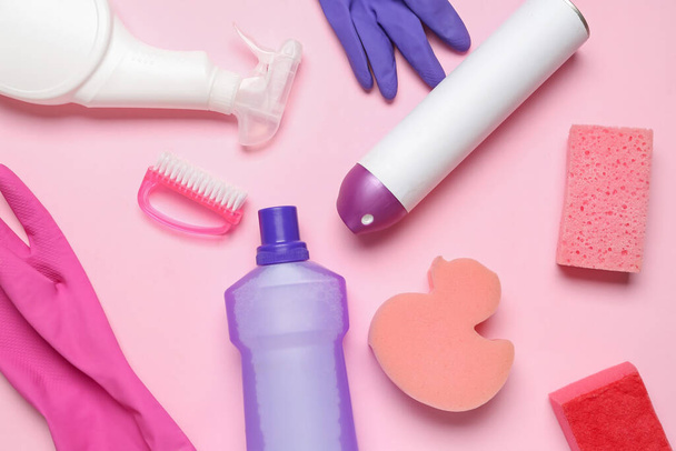Different cleaning supplies on pink background - Photo, Image