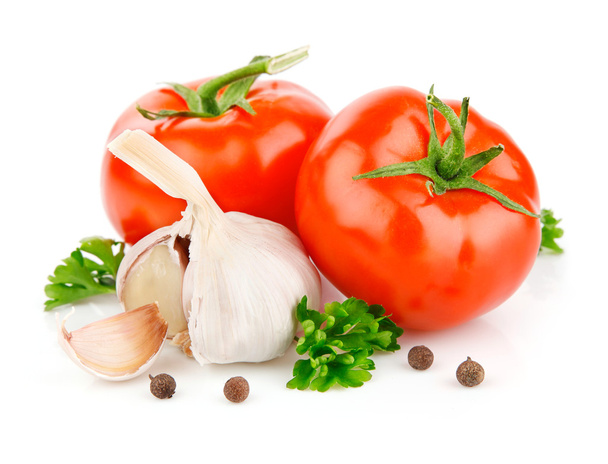 помидоры и чесночные овощи со специями петрушки
 - Фото, изображение
