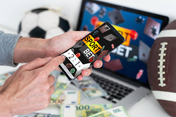 Live in-play betting app on smartphone display, a woman is betting at home and winning, POV shot. High quality photo - Fotografie, Obrázek