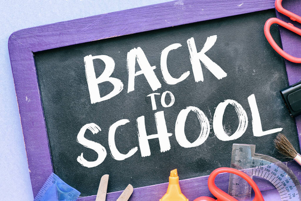 BACK TO SCHOOL words written on a black chalk board. - Photo, Image