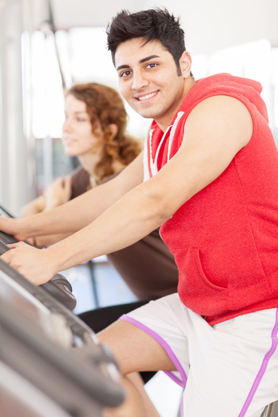 Young adult man looking at the camera while doing workout on the - Photo, Image