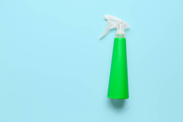 Spray bottle of detergent on blue background - Photo, Image