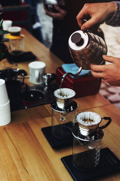 Demonstrating how to make pour over coffee - Photo, Image