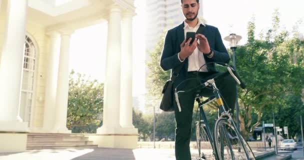 Smartphone, bicycle and city man, business agent or architect analysis, check or planning architecture building development. Cycling, digital blueprint or person on transport bike for travel commute. - Footage, Video
