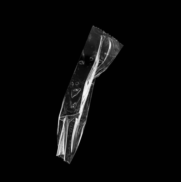 adhesive plastic tape isolated on black background - Photo, Image