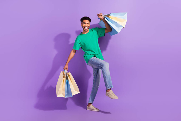 Full size photo of young guy wear trendy outfit shopaholic fashion designer big summer sale discounts isolated on violet color background. - Foto, Imagen