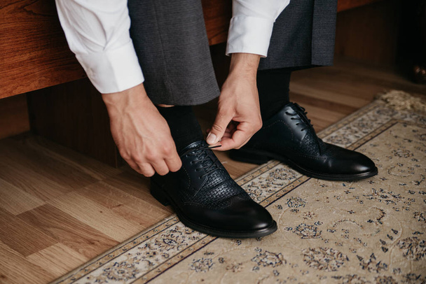 A man wears leather shoes - 写真・画像