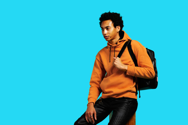 young adult student with backpack looking away ready for back to school - Photo, Image