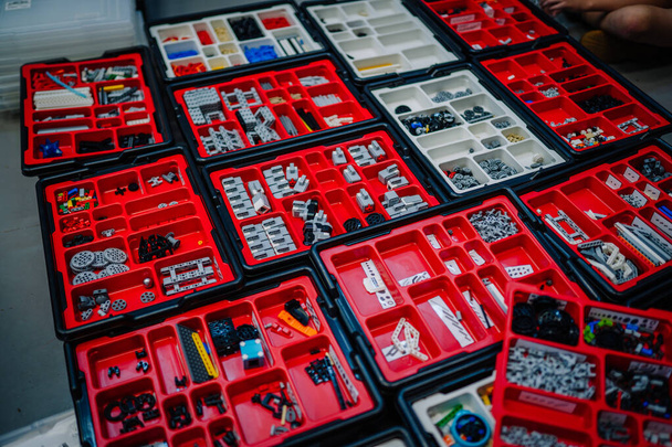 plastic blocks are arranged in a red box  - Фото, зображення