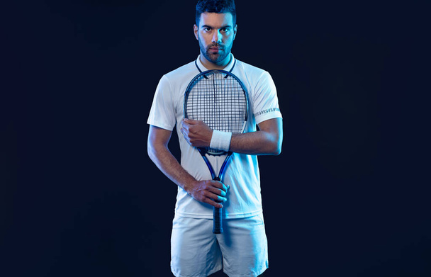 Tennis player with racket. Man athlete playing isolated on background - Фото, зображення