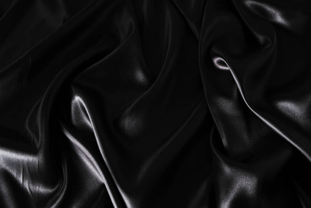 Silk fabric, abstract wavy black satin fabric background - Фото, изображение