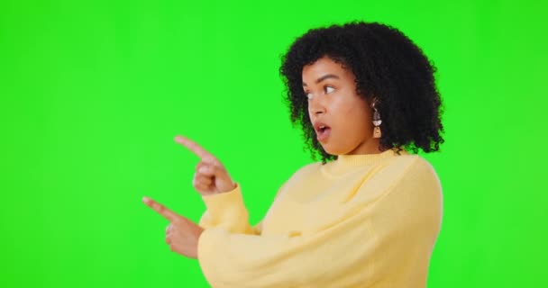 Green screen, pointing or woman shocked by news announcement or marketing mockup space. Face, omg or hands of surprised person on studio background to show flow chart info, deal offer or choice list. - Footage, Video