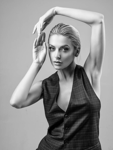 Pretty girl holding arms up showing smooth armpits. Armpit hair removal epilation. - Valokuva, kuva