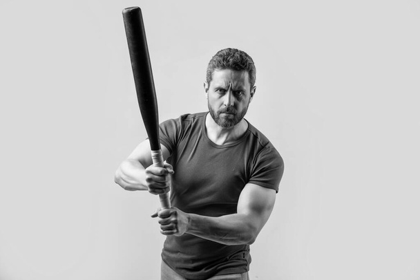 photo of man with aggression, selective focus. man with aggression threatening. man express aggression with bat isolated on grey background. aggression of man with bat in studio. - Valokuva, kuva