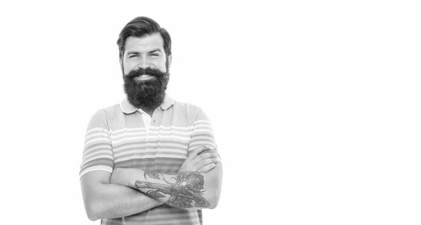 Happy unshaven man keeping arms crossed. Confident man with beard smile. Bearded man isolated on white, copy space - Фото, зображення