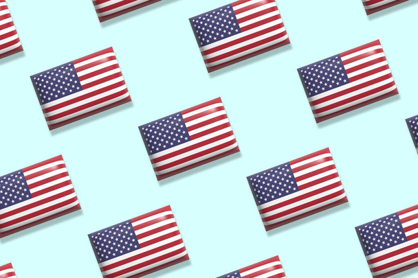 Flags of United States of America on a blue gradient background. USA flags. Flat lay. Holiday, festival, celebration concept - Photo, Image
