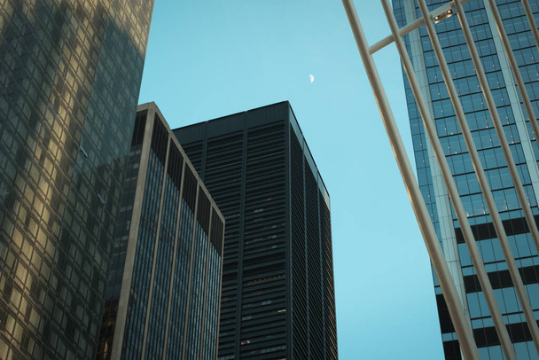 The moon in the evening sky, at the Oculus, Manhattan, New York - Photo, image