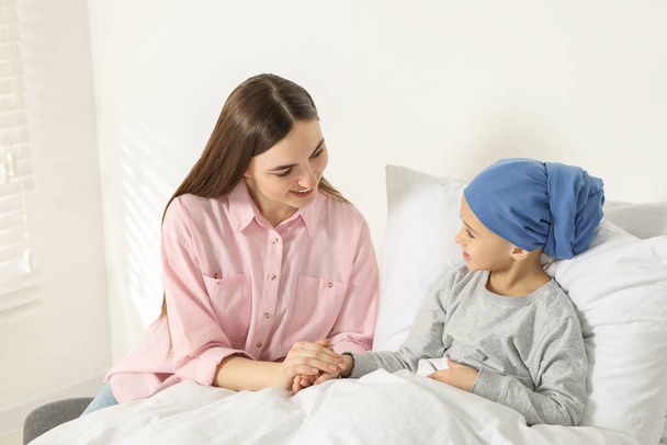 Childhood cancer. Mother and daughter in hospital - Фото, изображение