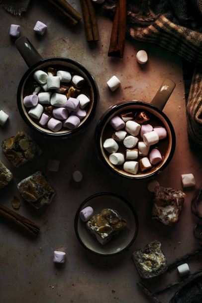 Marshmallows dipped in hot chocolate flat lay Christmas food photography - Foto, Imagen