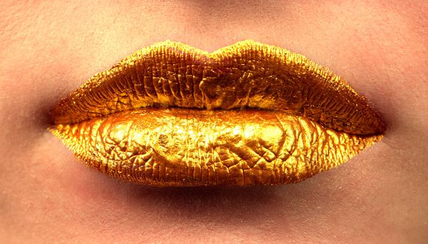 Golden beautiful lips close up. - Φωτογραφία, εικόνα