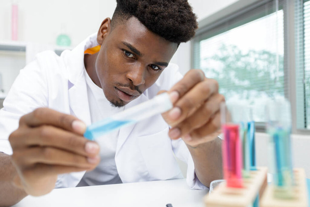 lab technician working with pipette in molecular laboratory - Photo, Image
