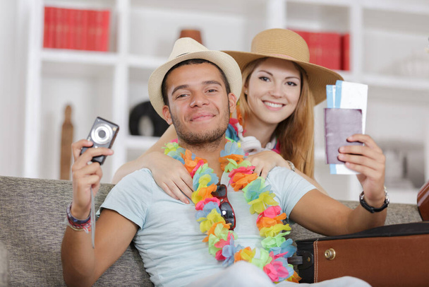 happy young couple with passports camera and tickets - Фото, изображение