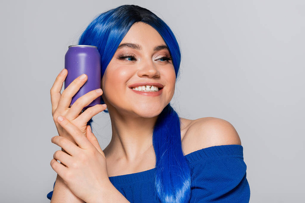 beauty trends, summer style, happy young woman with blue hair holding soda can on grey background, modern subculture, individualism, youth and lifestyle, vibrant color, self expression  - Photo, Image