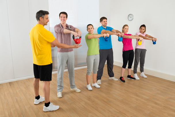 Fitness Instructor With People Exercising - Foto, Imagen