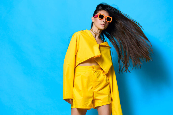 woman happiness happy style isolated young lifestyle attractive hair beauty trendy yellow girl brunette gesture fashion sunglasses beautiful romance modern expression long - Photo, Image
