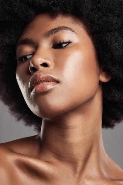 Face, black woman and natural beauty in studio, background or dermatology. African female model thinking of aesthetic shine, skincare treatment and facial glow for afro hair, self care or cosmetology. - Foto, immagini