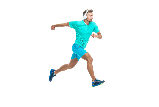 sportsman runner running isolated on white backdrop. Man sportsman running for exercise in studio. sportsman jogger running. The sportsman running at full speed towards the finish line. - Foto, immagini