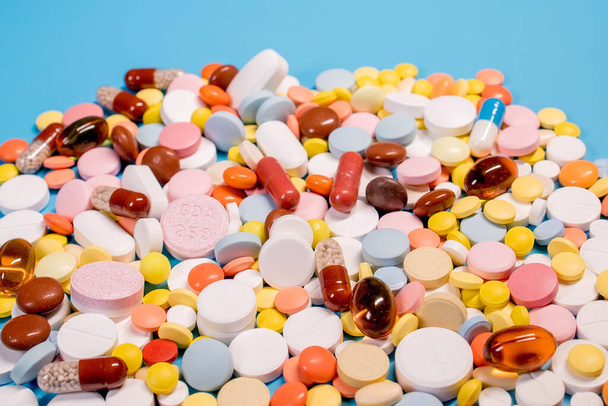 Many colorful different medicines and pills on top. The concept of medical treatment. - Foto, imagen