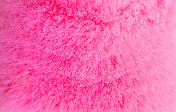 ροζ γούνινο φόντο, χνουδωτό χαλί σε σκόνη. - Φωτογραφία, εικόνα