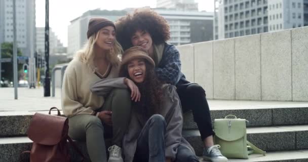 Laugh, face and happy friends relax on city steps outdoors, having fun and bonding outside. Smile, portrait and group of women with diversity embrace in town on the weekend, cheerful and free. - Footage, Video