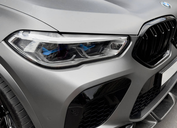 Yerevan, Armenia, June 20, 2023: BMW X6M Competition 2022 front view. Radiator grill and headlight close up - Foto, afbeelding