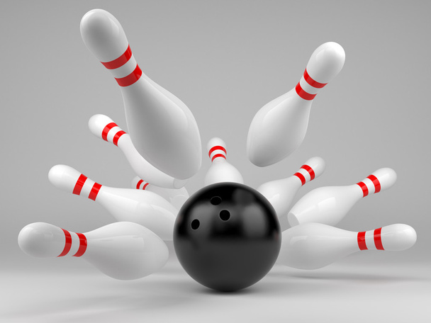Black bowling ball and scattered skittles - Photo, Image